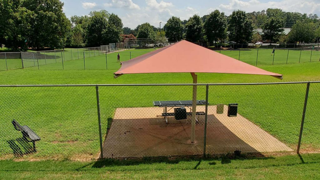 Lewis Park Cobb Marietta Covered seating in dog off-leash area