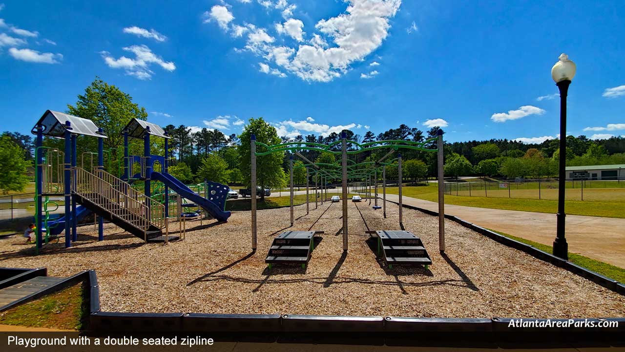 Clarkdale-Cobb-Austell-Playground-with-a-double-seated-zipline