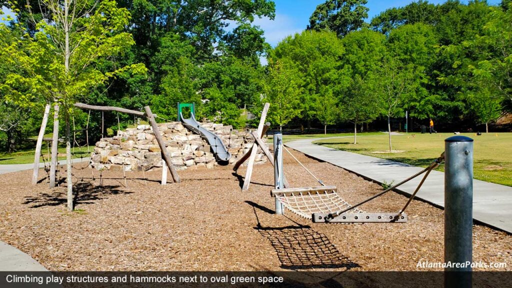 Georgian-Hills-Park-Dekalb-Brookhaven-Climbing-play-structures-and-hammocks-next-to-oval-green-space