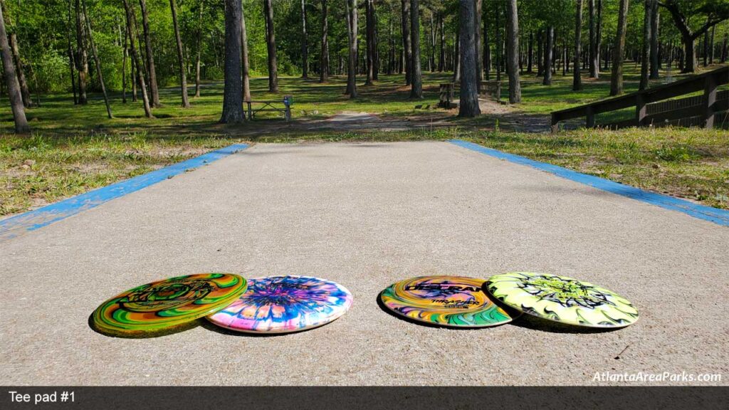 Louise-Suggs-Memorial-Park-Cobb-Austell-Frog-Rock-Disc-Golf-Park-Launching-pad-1-with-discs