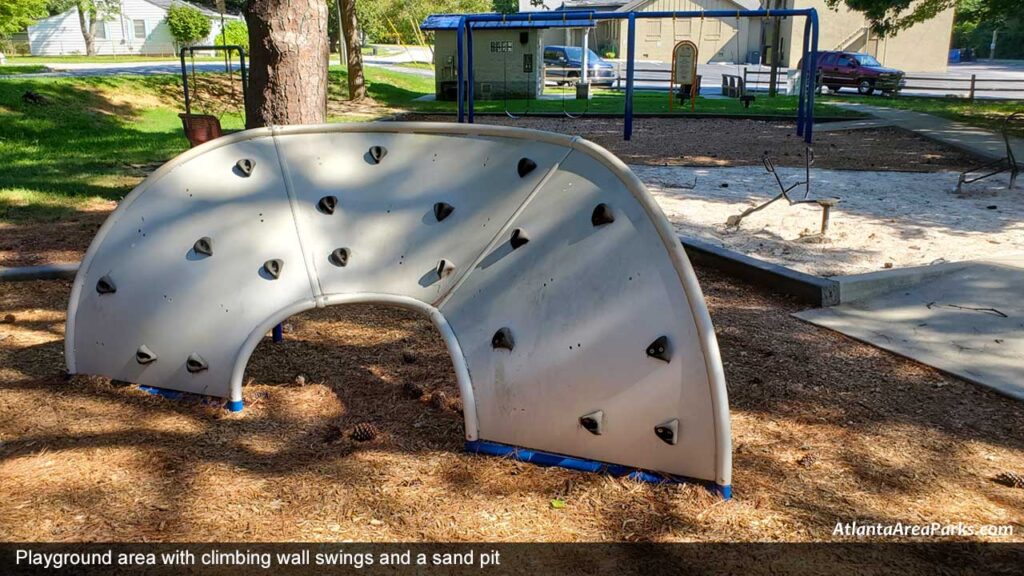 Victory-Park-Cobb-Marietta-Playground-area-with-climbing-wall-swings-and-a-sand-pit